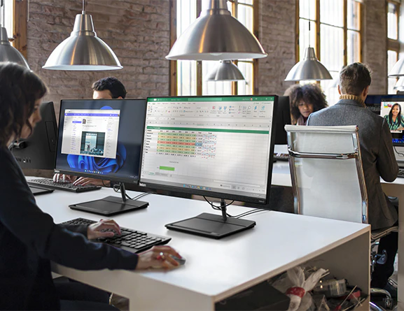 Front view of a Lenovo ThinkCentre Neo 30a (24” Intel) all-in-one business PC being used in an office.